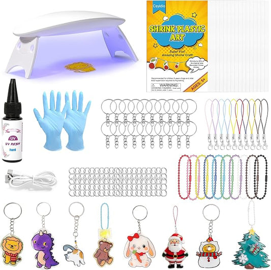 Csyidio 160PCS Shrink Plastic Sheet Kit with 15PCS Shrink Papers, UV Resin, UV Lamp and Keychains Accessories for Kids Craft Ornaments, DIY Key Chains & Christmas Decor